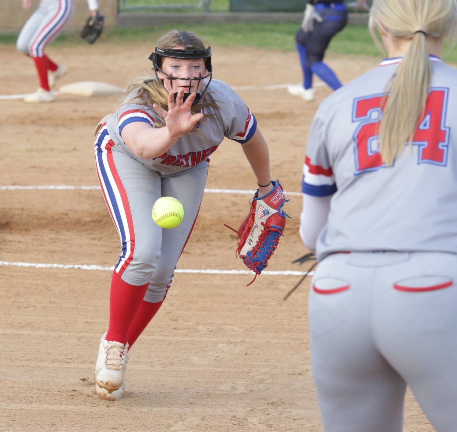 Alba-Golden’s Adielyn Smith comes off the mound and tosses to Alexis Wilmut at first after fielding a bunt in the win over Detroit.